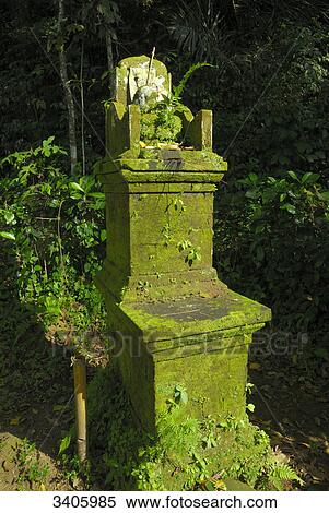 Stock Photography - Stele with sacrificial offering in djungle, Bali, Indonesia, Asia . Fotosearch