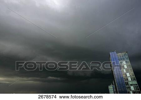Stormclouds over skyscrapers View Large Photo Image Picture - Stormclouds over skyscrapers . Fotosearch