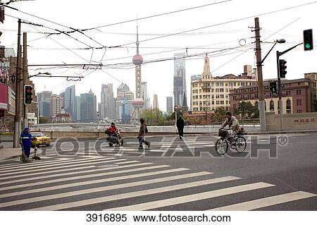 Stock Photography - Street scene and skyline with Oriental Pearl Tower, Pudong, Shanghai, China, Asia . Fotosearch