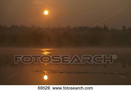 Sunrise over lake, Yggerydson Lake, Smaland, Sweden View Large Photo Image Stock Photo - Sunrise over lake, Yggerydson Lake, Smaland, Sweden . Fotosearch