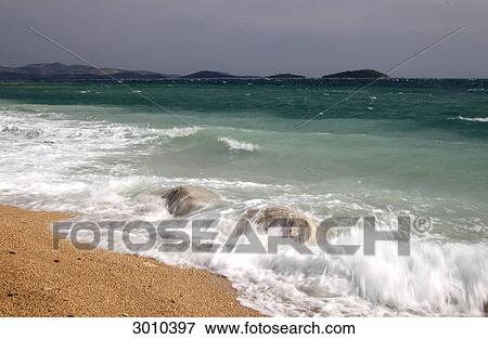 Stock Photo - Surge at the beach of Sibenik, Croatia . Fotosearch