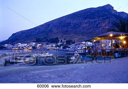Stock Photograph - Tavern lit up at night, Malvasia, Peloponnese, Greece . Fotosearch