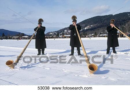 Stock Photo - Three men playing alphorns, Alps, Rottach-Egern, Bavaria, Germany . Fotosearch