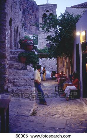 Three people at tavern, Malvasia, Peloponnese, Greece View Large Photo Image Stock Photography - Three people at tavern, Malvasia, Peloponnese, Greece . Fotosearch