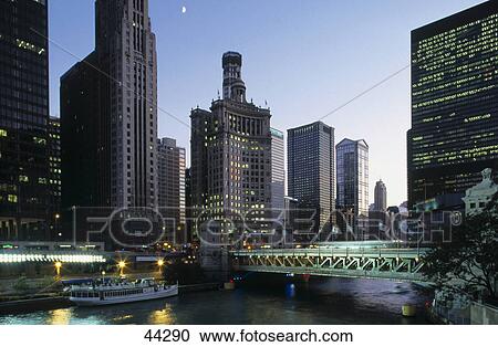 Tourboat in river in city, Wacker Drive, Michigan Avenue, Chicago River, Chicago, Illinois, USA View Large Photo Image Stock Image - Tourboat in river in city, Wacker Drive, Michigan Avenue, Chicago River, Chicago, Illinois, USA . Fotosearch