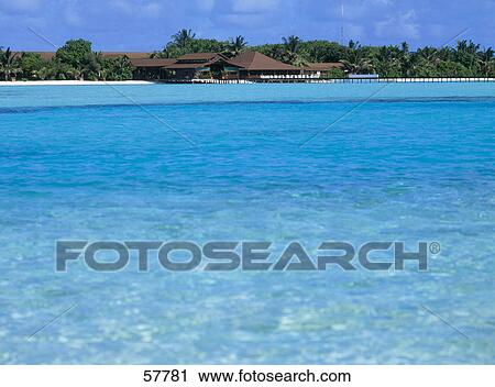 Stock Image - Tourist resort at the waterfront, Atoll, Maldives . Fotosearch
