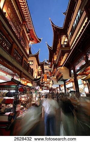 Stock Image - Tourists at market, Yuyuan Garden Bazaar, Shanghai, China . Fotosearch