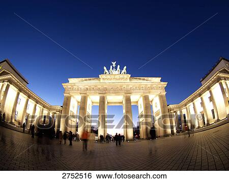 Tourists at monument lit up during dusk, Brandenburg Gate, Berlin, Germany View Large Photo Image Stock Photograph - Tourists at monument lit up during dusk, Brandenburg Gate, Berlin, Germany . Fotosearch