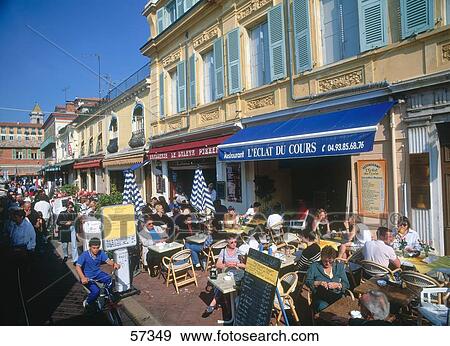 Stock Photo - Tourists at sidewalk cafe, Nice, Provence-Alpes-Cote d'Azur, France . Fotosearch
