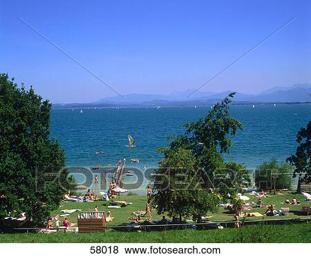 Tourists at the lakeside, Germany View Large Photo Image Stock Photo - Tourists at the lakeside, Germany . Fotosearch