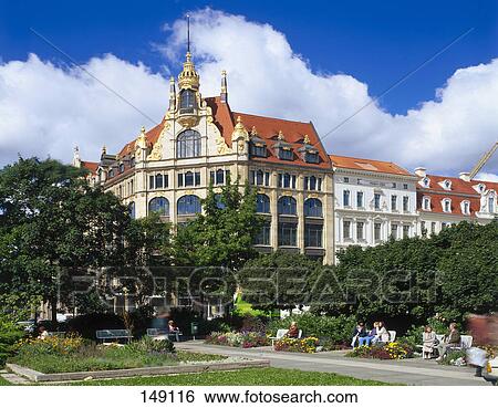 Tourists sitting in park, Saxony, Germany  View Large Photo Image Stock Photograph - Tourists sitting in park, Saxony, Germany . Fotosearch