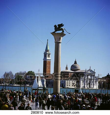 Tourists walking near column, Column Of San Marco, St. Marks Square, San Giogio Maggiore, Venice, Italy View Large Photo Image Stock Image - Tourists walking near column, Column Of San Marco, St. Marks Square, San Giogio Maggiore, Venice, Italy . Fotosearch