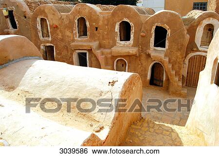 Stock Photograph - Traditional granaries (ghorfas) at the southtunisian city of Medenine . Fotosearch