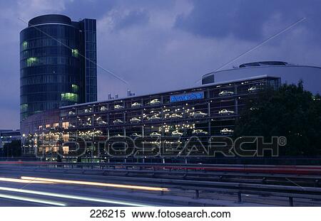 Stock Photography - Traffic in motion in front of buildings . Fotosearch