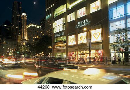 Traffic moving on road in city, Water Tower Place, Chicago, Illinois, USA View Large Photo Image Stock Photo - Traffic moving on road in city, Water Tower Place, Chicago, Illinois, USA . Fotosearch