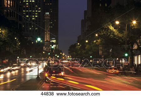 Stock Photo - Traffic on road at night, Water Tower Place, Chicago, Illinois, USA . Fotosearch