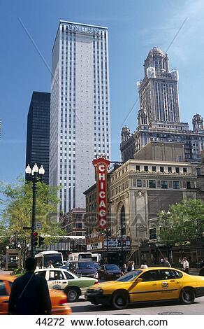 Stock Image - Traffic on road in front of theater, Chicago Theater, State Randolph Street, Chicago, Illinois, USA . Fotosearch