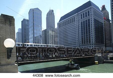 Stock Photo - Tram on bridge across river, Wacker Drive, Chicago River, Chicago, Illinois, USA . Fotosearch