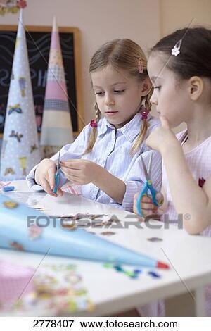 two girls with her cardbone cones View Large Photo Image Stock Photo - two girls with her cardbone cones . Fotosearch