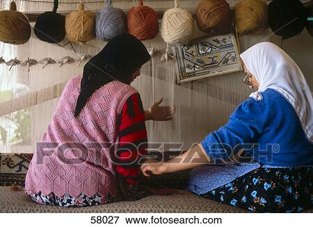 Two women knotting carpet, Goreme, Turkey View Large Photo Image Stock Photo - Two women knotting carpet, Goreme, Turkey . Fotosearch