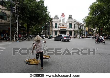 Vendor on a street in Hanoi, Vietnam View Large Photo Image Stock Photo - Vendor on a street in Hanoi, Vietnam . Fotosearch