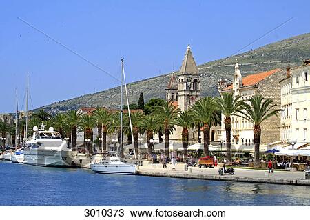 Stock Image - View from the water to the promenade of Trogir, Croatia . Fotosearch