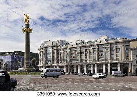 View of a Hotel and the monument of St. George on Tavisupleba Square, Tbilisi, Georgia View Large Photo Image Stock Photo - View of a Hotel and the monument of St. George on Tavisupleba Square, Tbilisi, Georgia . Fotosearch