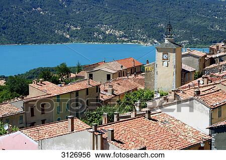 Stock Photograph - View of the rooftops and the church of Aiguines, France, high angle view . Fotosearch