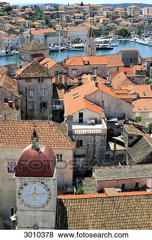 Stock Photo - View to clock tower and rooftops of Togir, Croatia, aerial view . Fotosearch