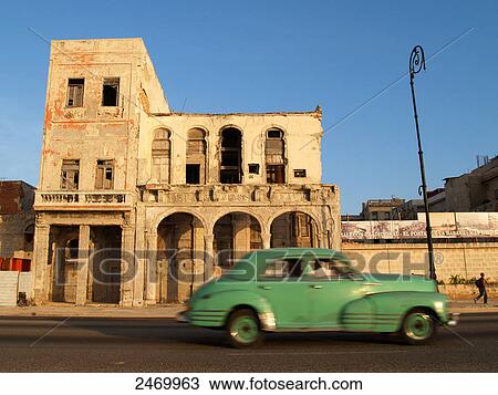 Vintage car moving on road, Havana, Cuba View Large Photo Image Stock Image - Vintage car moving on road, Havana, Cuba . Fotosearch