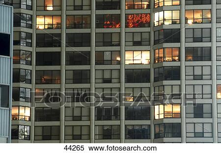 Windows of building lit up at night, Chicago, Illinois, USA View Large Photo Image Stock Photography - Windows of building lit up at night, Chicago, Illinois, USA . Fotosearch