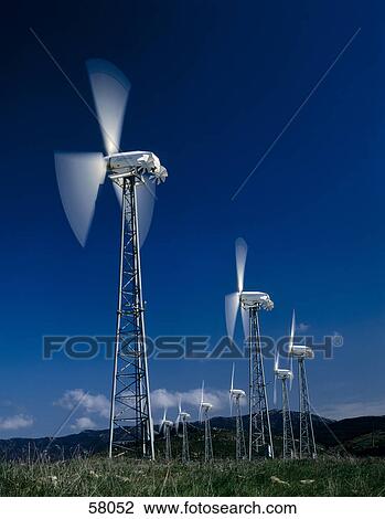 Stock Image - Windturbines on a landscape . Fotosearch