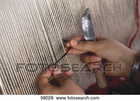 Stock Photo - Woman knotting carpet . Fotosearch