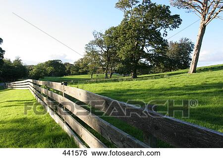 Stock Photograph - Wooden fence on rural landscape, County Mayo, Ireland . Fotosearch
