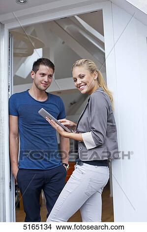 Picture - Young couple with ipad . Fotosearch
