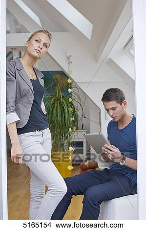 Young couple with ipad View Large Photo Image Picture - Young couple with ipad . Fotosearch