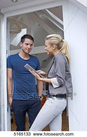 Stock Image - Young couple with ipad . Fotosearch