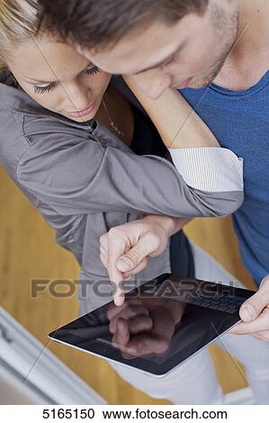 Young couple with ipad View Large Photo Image Stock Image - Young couple with ipad . Fotosearch