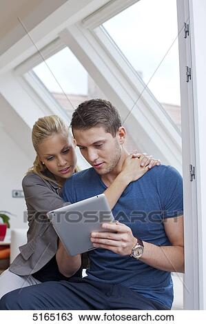 Young couple with ipad View Large Photo Image Stock Image - Young couple with ipad . Fotosearch