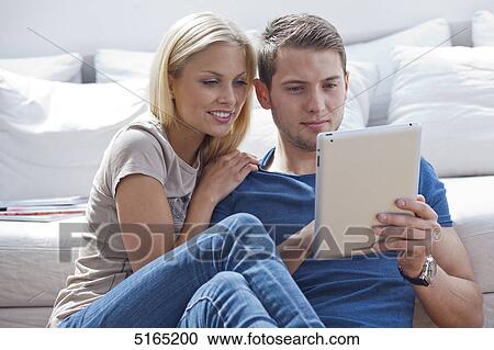 Young couple with ipad View Large Photo Image Stock Image - Young couple with ipad . Fotosearch