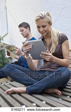 Young couple with ipad View Large Photo Image Stock Image - Young couple with ipad . Fotosearch
