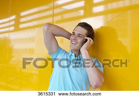 Young man on cell phone View Large Photo Image Stock Image - Young man on cell phone . Fotosearch
