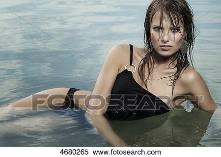 Stock Photography - Young woman in water . Fotosearch