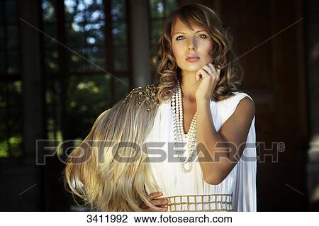 Young woman in white dress, portrait View Large Photo Image Stock Image - Young woman in white dress, portrait . Fotosearch