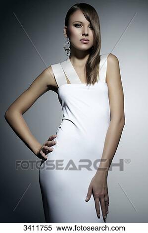 Young woman in white dress, portrait View Large Photo Image Stock Photography - Young woman in white dress, portrait . Fotosearch