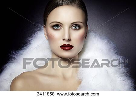 Young woman in white fur, portrait View Large Photo Image Stock Photo - Young woman in white fur, portrait . Fotosearch