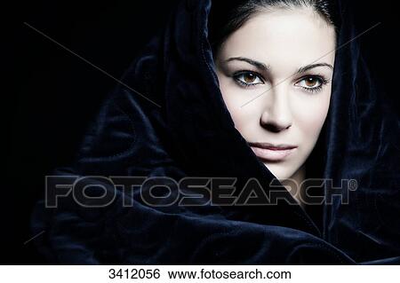 Young woman shrouded in blue cloth, portrait View Large Photo Image Stock Photograph - Young woman shrouded in blue cloth, portrait . Fotosearch