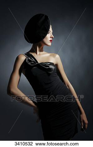 Young woman with black dress and hat View Large Photo Image Stock Image - Young woman with black dress and hat . Fotosearch