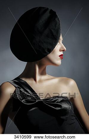 Young woman with black dress and hat View Large Photo Image Stock Photo - Young woman with black dress and hat . Fotosearch