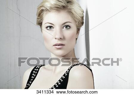 Young woman with blond hair, portrait View Large Photo Image Picture - Young woman with blond hair, portrait . Fotosearch